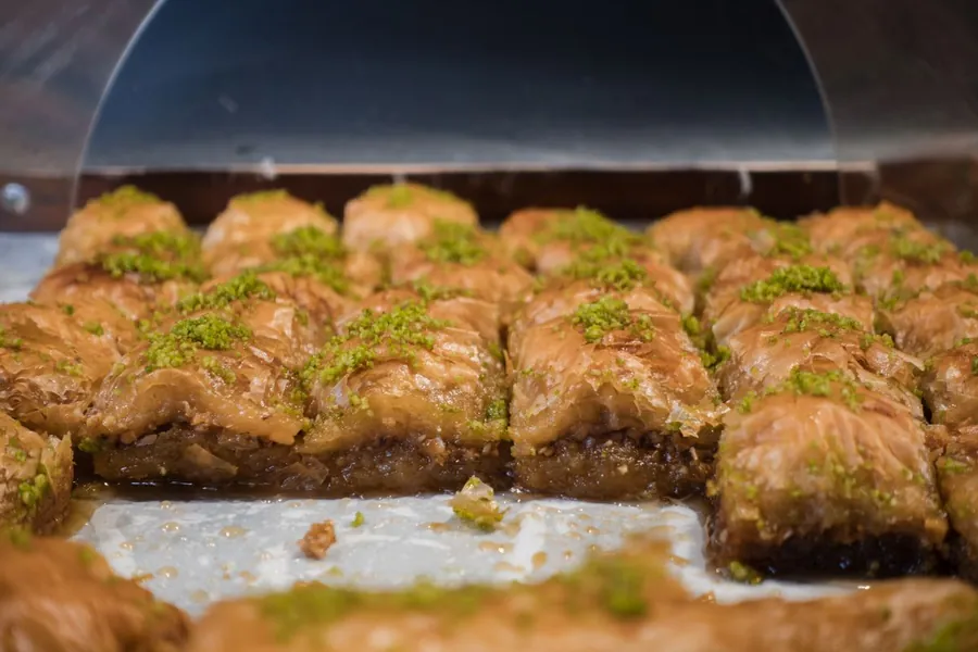 Pistachio baklava squares with flaky golden layers