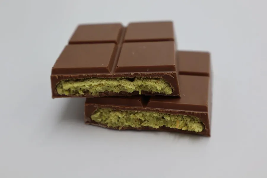 Chocolate bar with a green pistachio filling